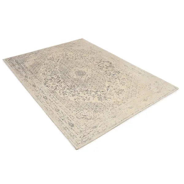 Diagonaal aanzicht van het vloerkleed TALMAR in de kleuren Geel / Grijs, gemaakt van Katoen.