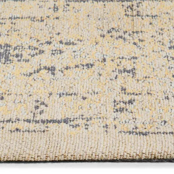 Zijkant detail aanzicht van het vloerkleed TALMAR in de kleuren Geel / Grijs, gemaakt van Katoen.
