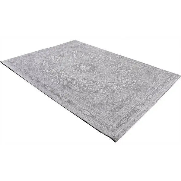 Diagonaal aanzicht van het vloerkleed TALMAR in de kleur Grijs, gemaakt van Katoen.