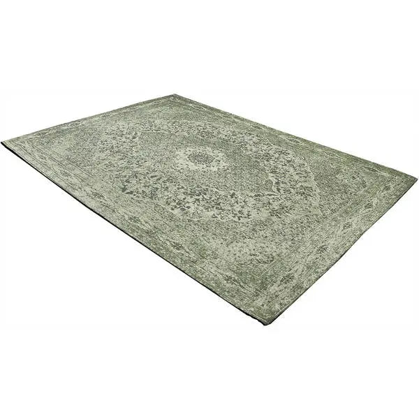 Diagonaal aanzicht van het vloerkleed TALMAR in de kleur Groen, gemaakt van Katoen.