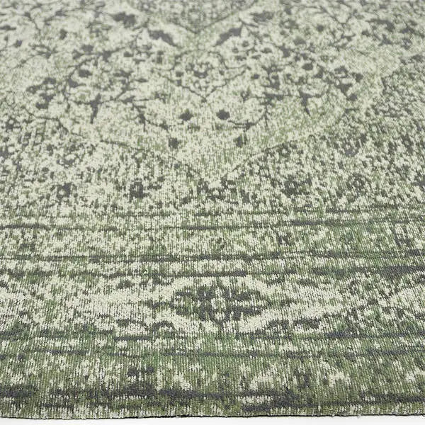 Zijkant detail aanzicht van het vloerkleed TALMAR in de kleur Groen, gemaakt van Katoen.