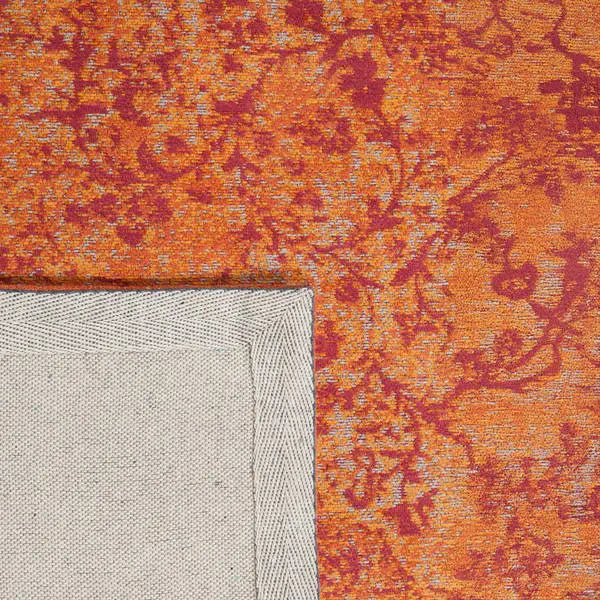 Achterkant hoek aanzicht van het vloerkleed TALMAR in de kleur Oranje, gemaakt van Katoen.
