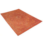 Diagonaal aanzicht van het vloerkleed TALMAR in de kleur Oranje, gemaakt van Katoen.