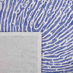 Achterkant hoek aanzicht van het vloerkleed TALRON UP in de kleur Blauw, gemaakt van Wol en Viscose mix.