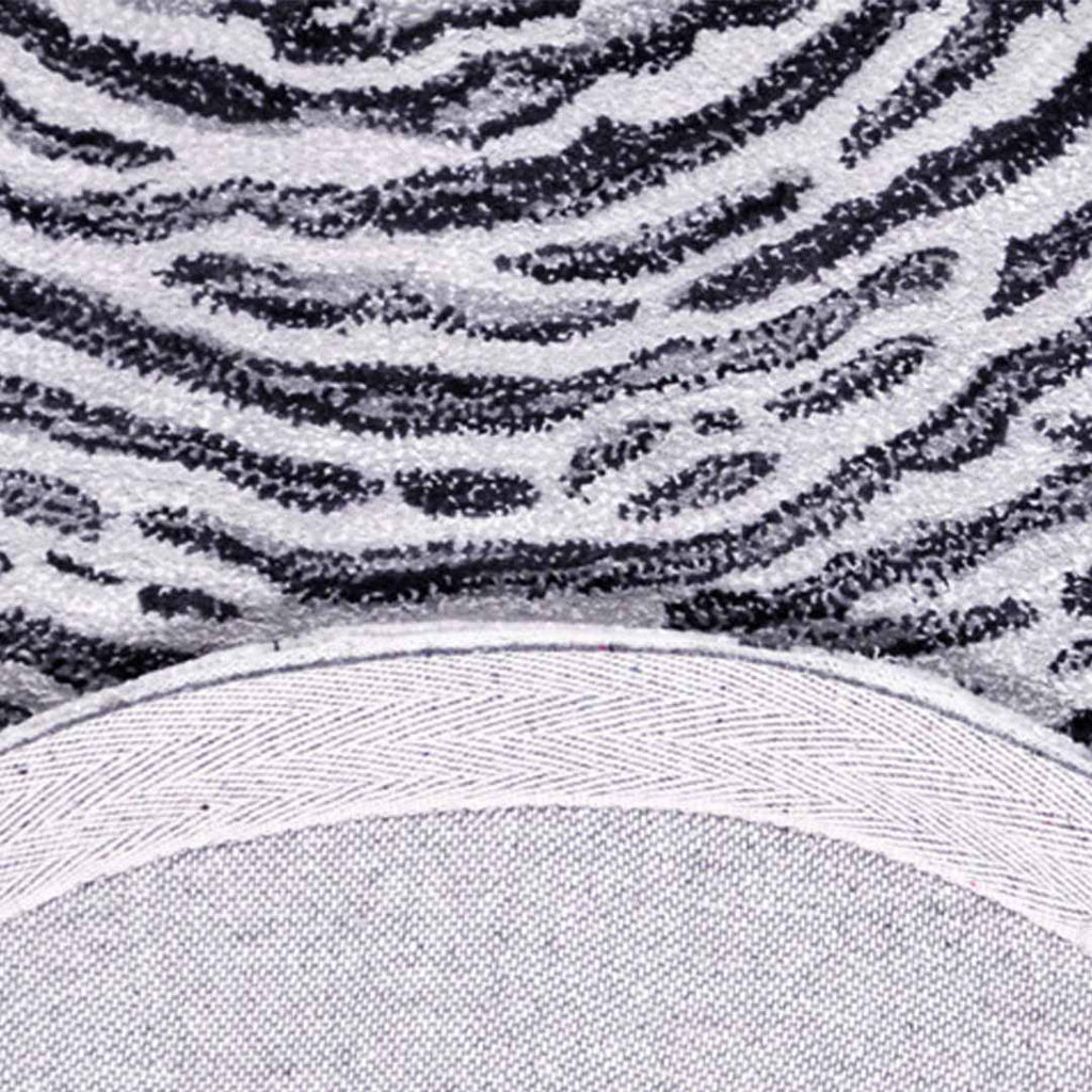 Zijkant detail aanzicht van het vloerkleed TALRON UP ovaal in de kleur Grijs, gemaakt van Wol en Viscose mix.