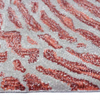 Zijkant detail aanzicht van het vloerkleed TALRON UP ovaal in de kleuren Roest / Roze, gemaakt van Wol en Viscose mix.