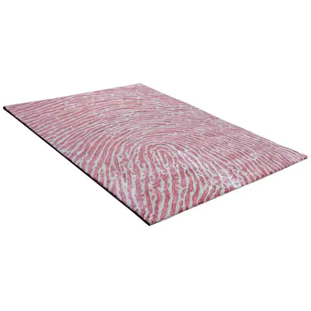 Diagonaal aanzicht van het vloerkleed TALRON UP in de kleuren Roest / Roze, gemaakt van Wol en Viscose mix.