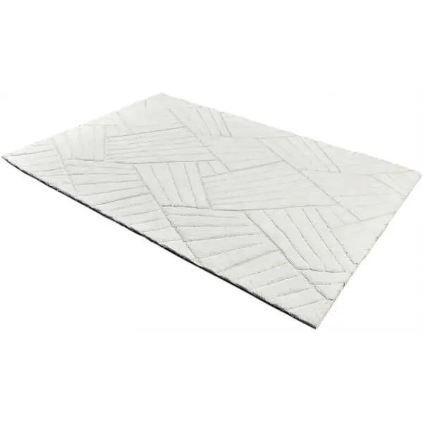 Diagonaal aanzicht van het vloerkleed TYRON in de kleur Wit, gemaakt van Polyester.