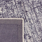 Achterkant hoek aanzicht van het vloerkleed VALCERA in de kleur FE Blauw, gemaakt van Viscose.