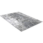 Diagonaal aanzicht van het vloerkleed VALCERA in de kleur Grijs, gemaakt van Viscose.