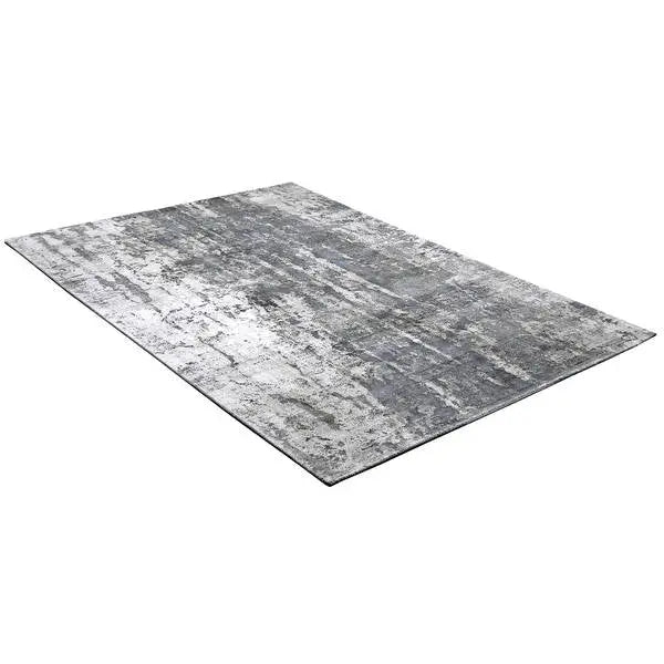 Diagonaal aanzicht van het vloerkleed VALCERA in de kleur Grijs, gemaakt van Viscose.