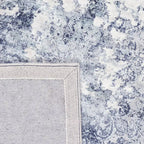 Achterkant hoek aanzicht van het vloerkleed VALCERA modern in de kleur Blauw, gemaakt van Viscose.