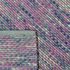 Achterkant hoek aanzicht van het vloerkleed ZAVEN in de kleuren Multikleurig / Blauw / Roze, gemaakt van Wol mix.